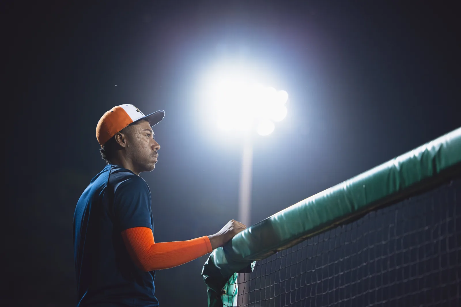 Rolando Heredia-Bustos, Founder & Executive Director, at the ballfield under the lights